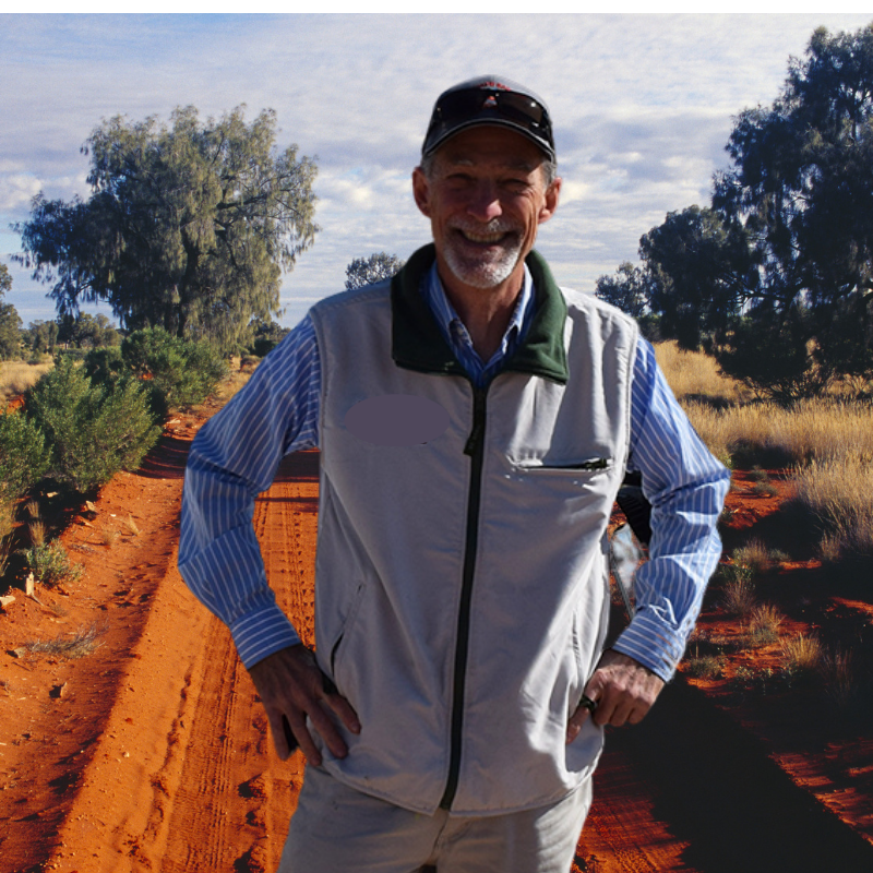 Clark, tour guide and artist, on a red dirt track