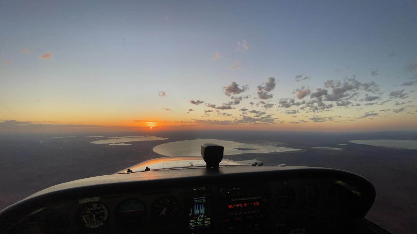 Sunset over Lake Eyre from the cockpit of a scenic flight
