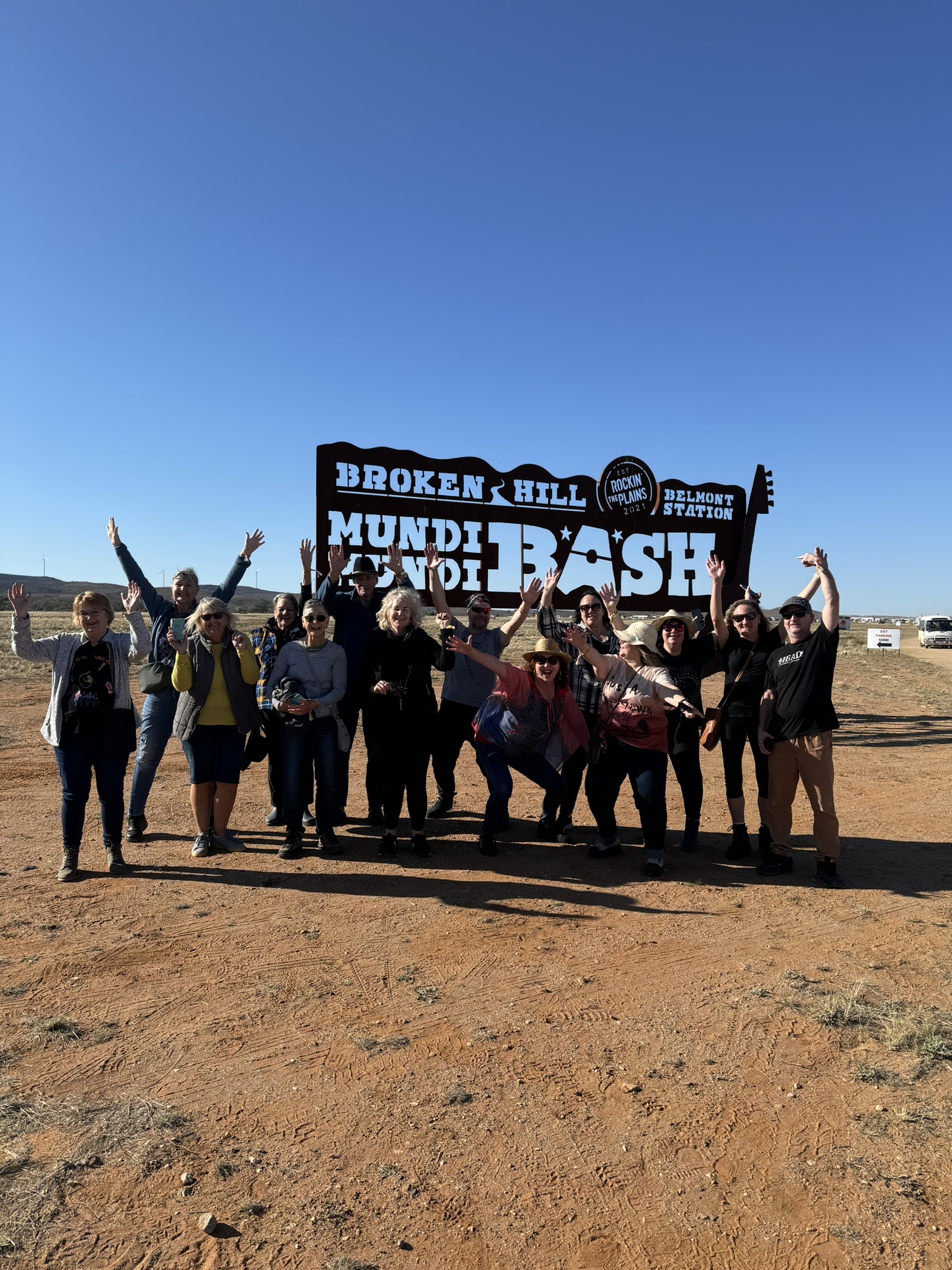 Guests in front of the Broken Hill Mundi Mundi Bash sign