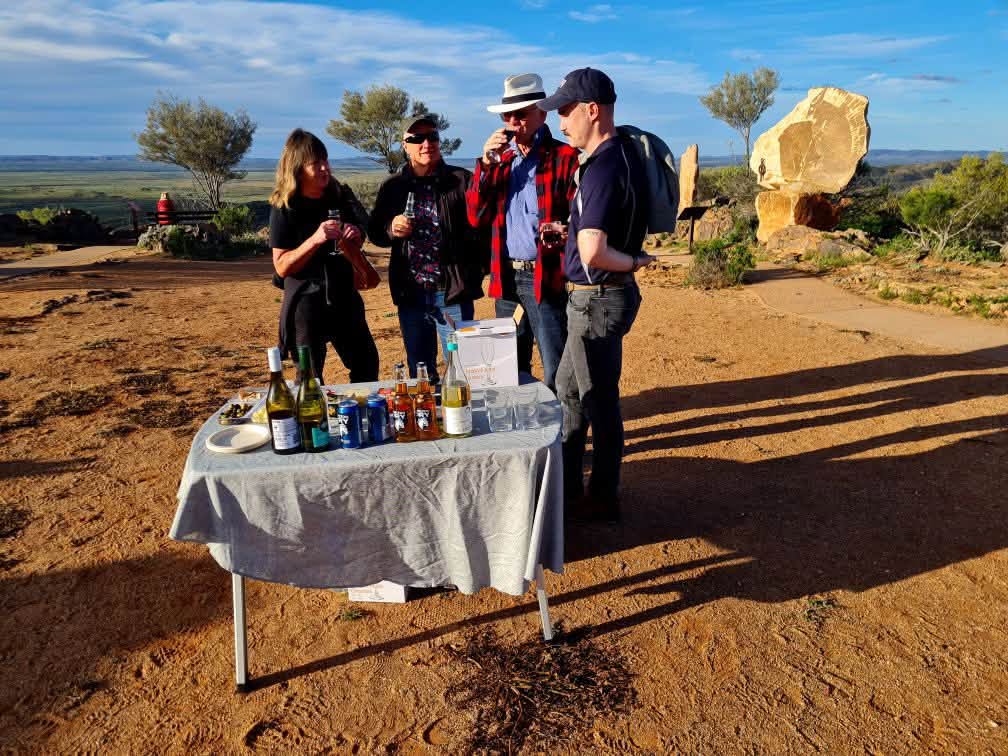 Guests enjoying sunset drinks and nibbles at the Living Desert Sculptures
