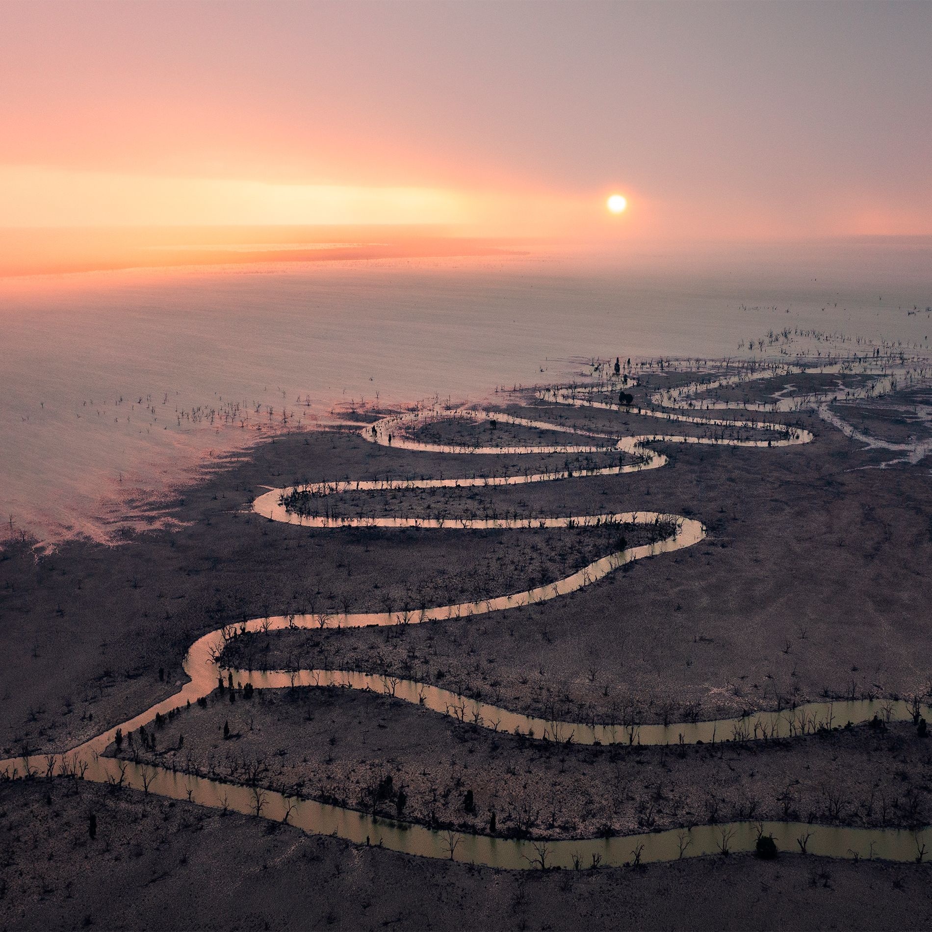 Aerial sunrise over Menindee Lakes with a winding shoreline