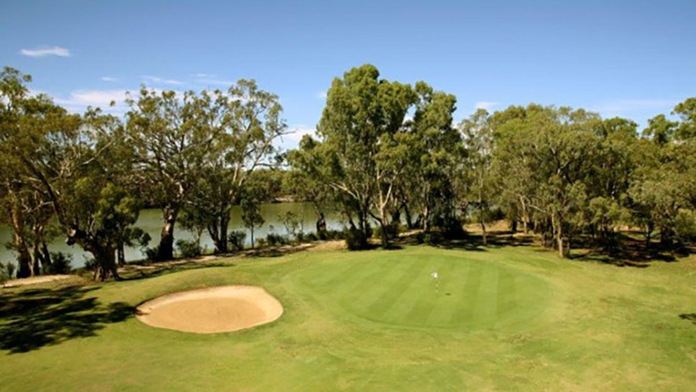 Green and bunker beside the Murray River at a riverside golf course