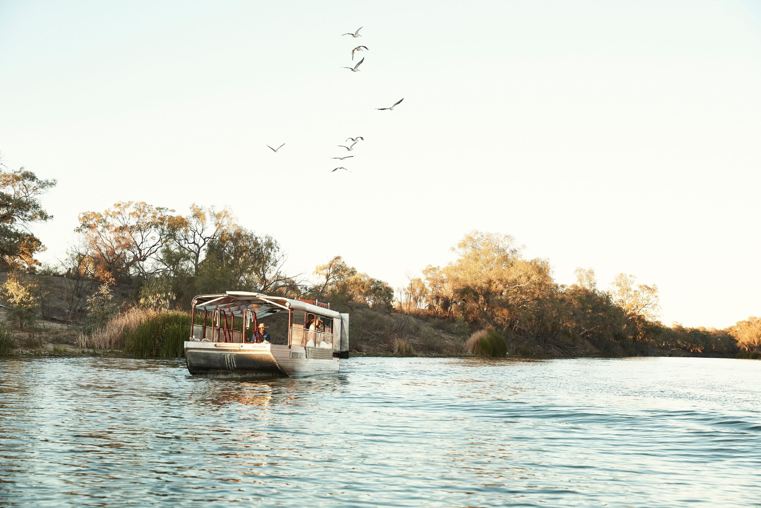 The River Lady vessel cruising along the Darling River in Menindee