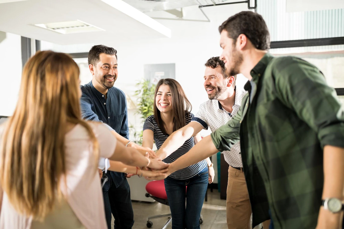 The Rock Solid Marketing team stacking hands together