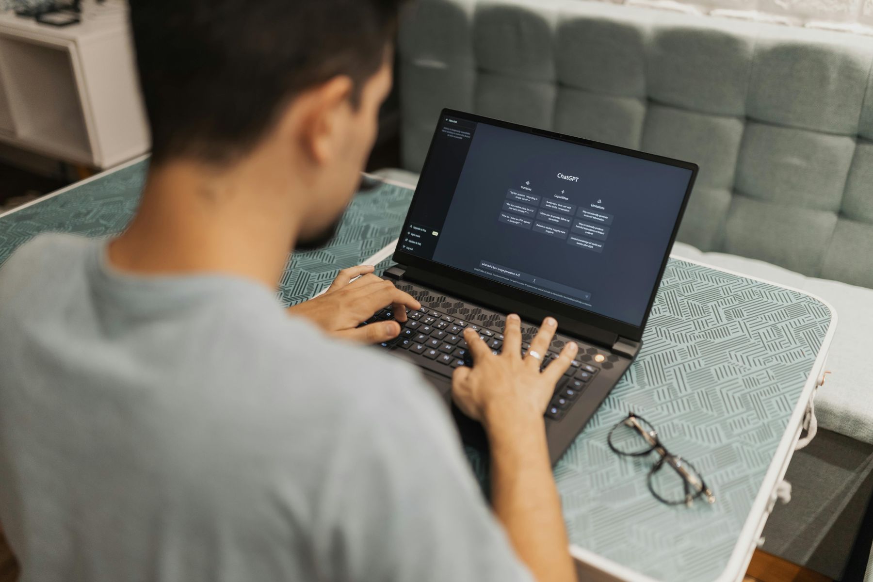 Marketer working on SEO at a laptop